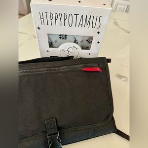 New Skip Hop changing pad with wipe case and 6 reusable food pouches.